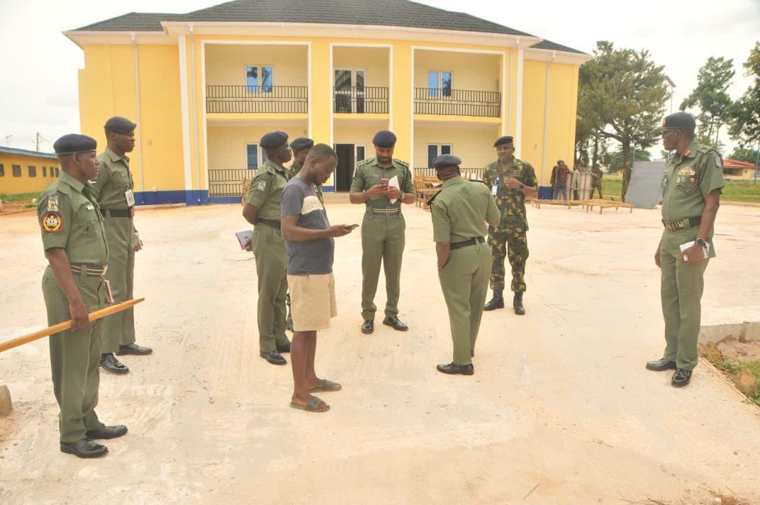 Forecourt inspection. Army personnel and the team inspecting the forecourt works.